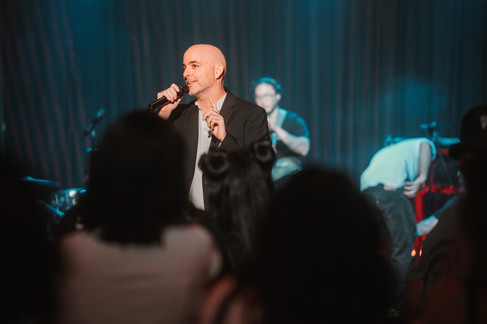 Sean Barcoe speaking on stage at a BarCoe Studios production